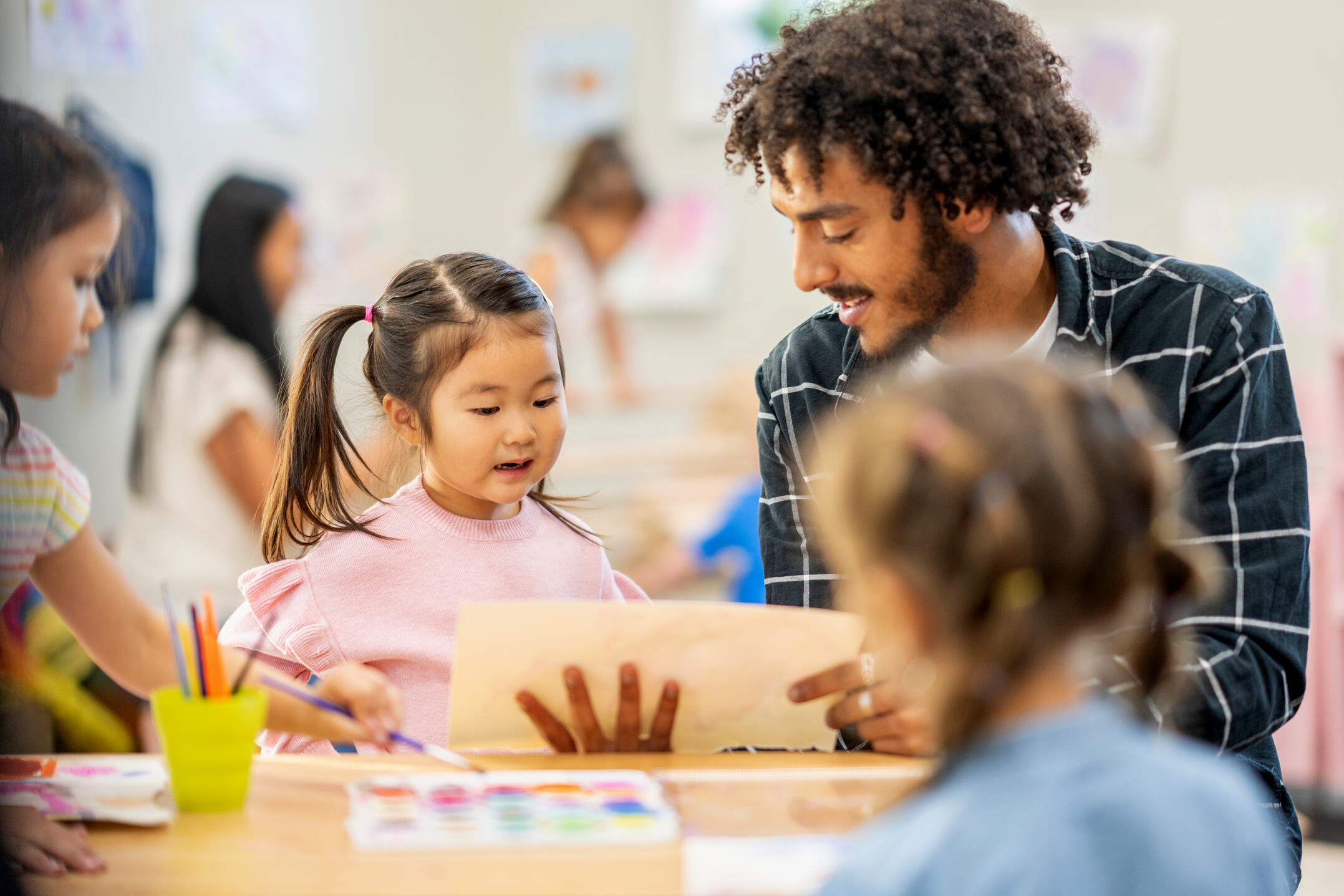 Male Childcare Worker with a Student