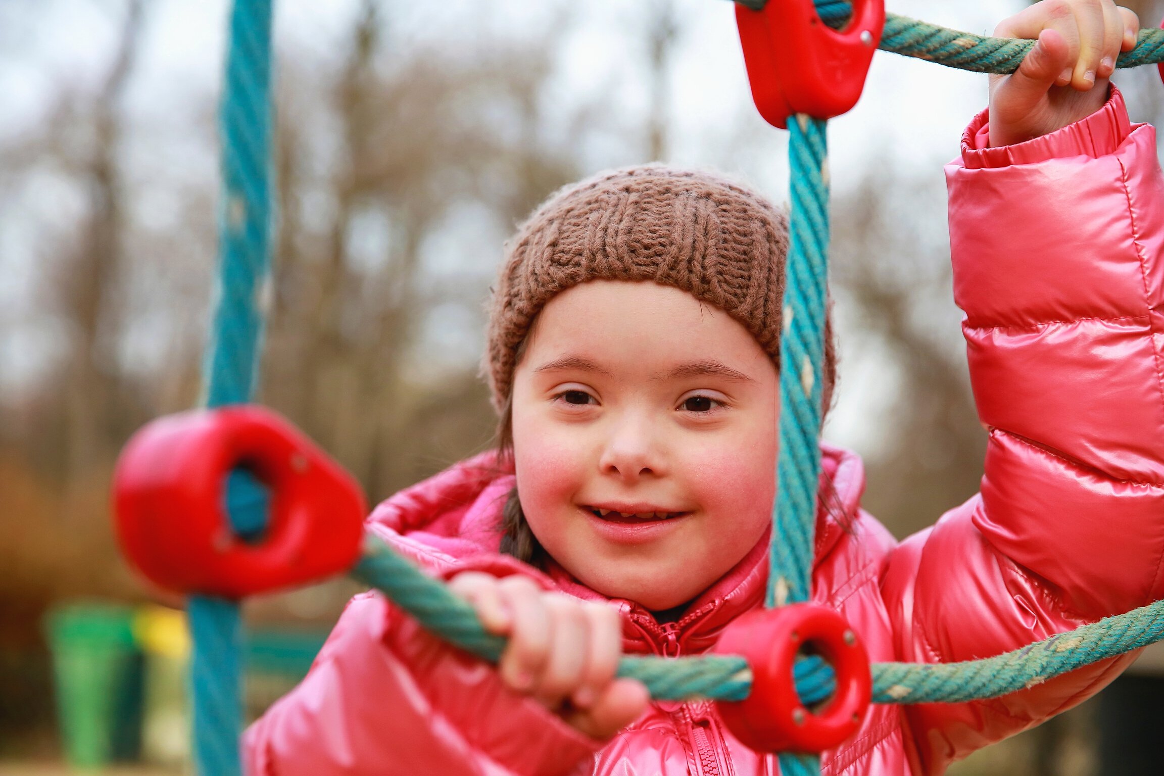 Child Playing in Climbing Nets at the Playground